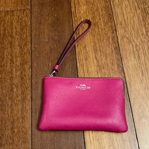 Fuchsia pink coach clutch wristlet with card holder on inside and silver zipper